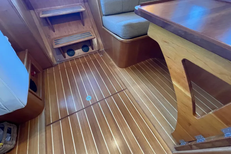 Slide: The Image of Interior of 2006 PDQ 34 Power Catamaran with wooden flooring and seating area. - 27