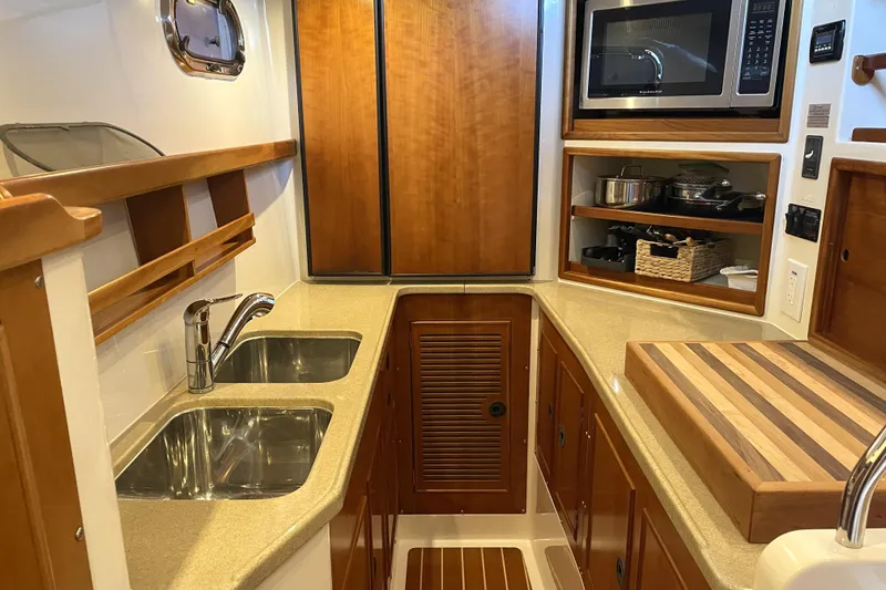 Slide: The Image of Galley kitchen in 2006 PDQ 34 Power Catamaran with dual sinks and microwave. - 29