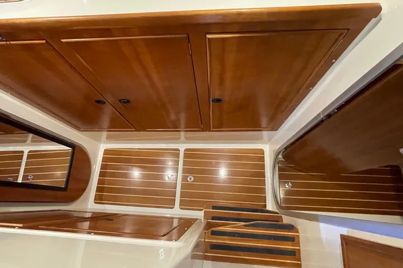 Slide: The Image of Interior of 2006 PDQ 34 Power Catamaran with wooden cabinetry and steps. - 34