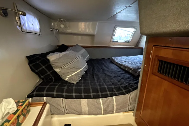 Slide: The Image of Cozy cabin interior of 2006 PDQ 34 Power Catamaran with bed and window. - 39