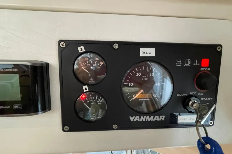 Slide: The Image of Control panel of a 2006 PDQ 34 Power Catamaran with Yanmar gauges and key ignition. - 43