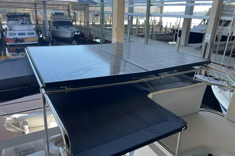 Slide: The Image of Solar panels on a 2006 PDQ 34 Power Catamaran in a marina. - 9