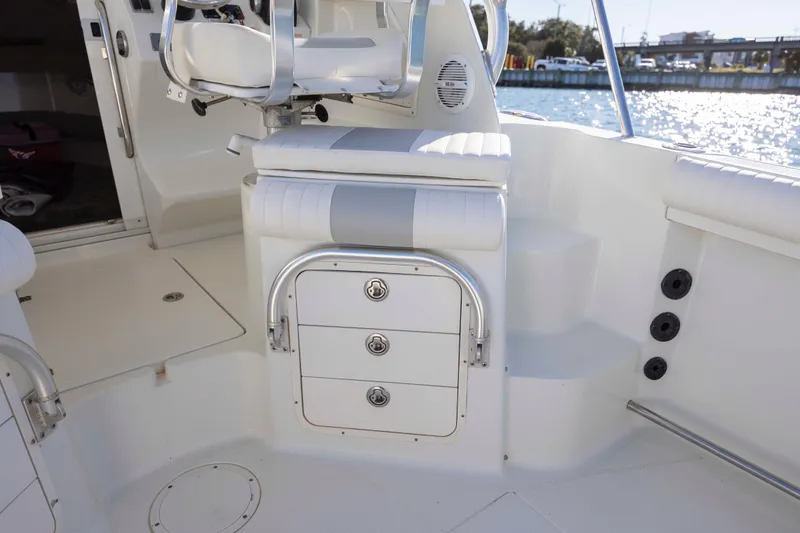 Slide: The Image of Interior of 2006 Sailfish 2660 WAC boat with seating and storage compartments. - 21