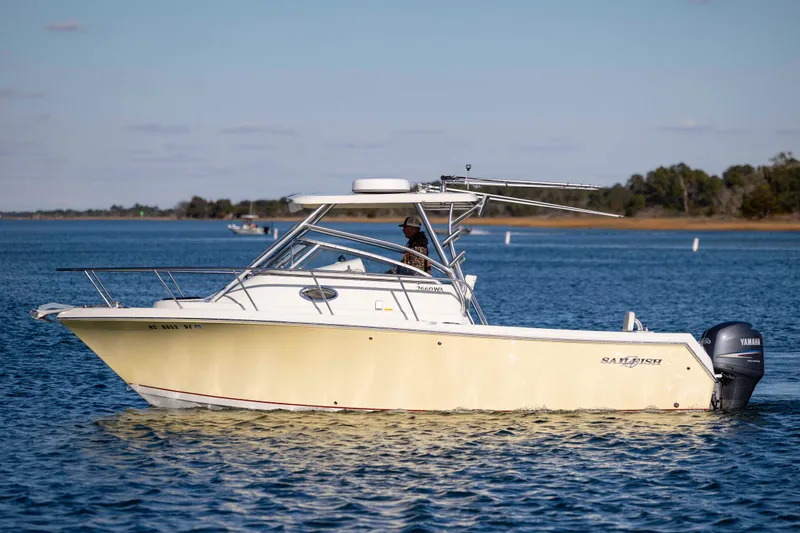 Slide: The Image of 2006 Sailfish 2660 WAC boat on calm water with Yamaha outboard motor. - 9