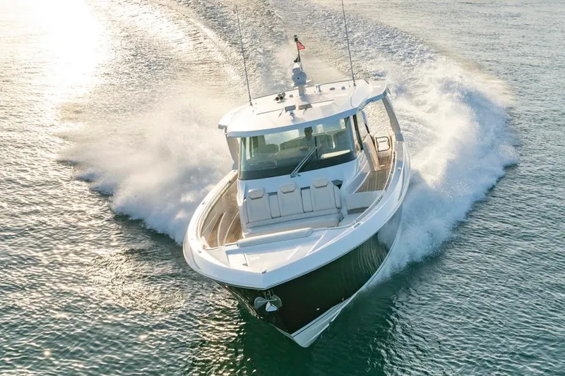 Slide: The Image of Manufacturer Provided Image: 2025 Tiara Yachts 48 LS cruising on open water, showcasing sleek design and powerful performance. - 4