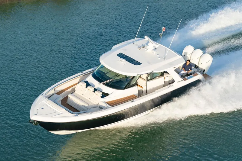 Slide: The Image of Manufacturer Provided Image: 2025 Tiara Yachts 48 LS cruising on water, showcasing sleek design and powerful engines. - 5