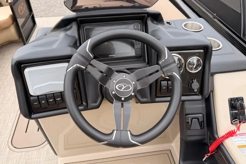 Slide: The Image of 2026 Veranda VR 235 L boat dashboard with steering wheel and control panel. - 11