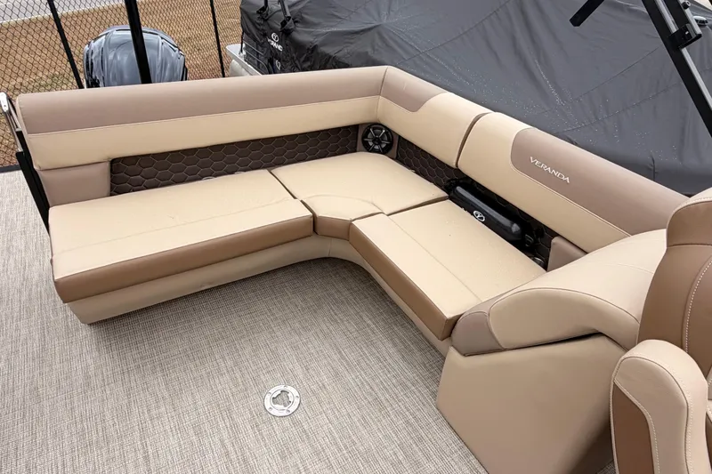 Slide: The Image of Luxurious seating on 2026 Veranda VR 235 L pontoon boat, featuring beige and brown upholstery. - 13
