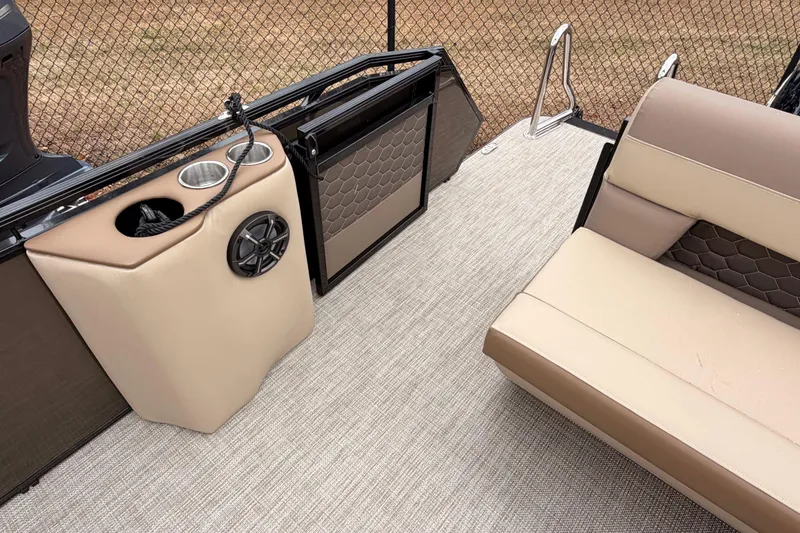 Slide: The Image of 2026 Veranda VR 235 L boat interior with beige seating and cup holders. - 14