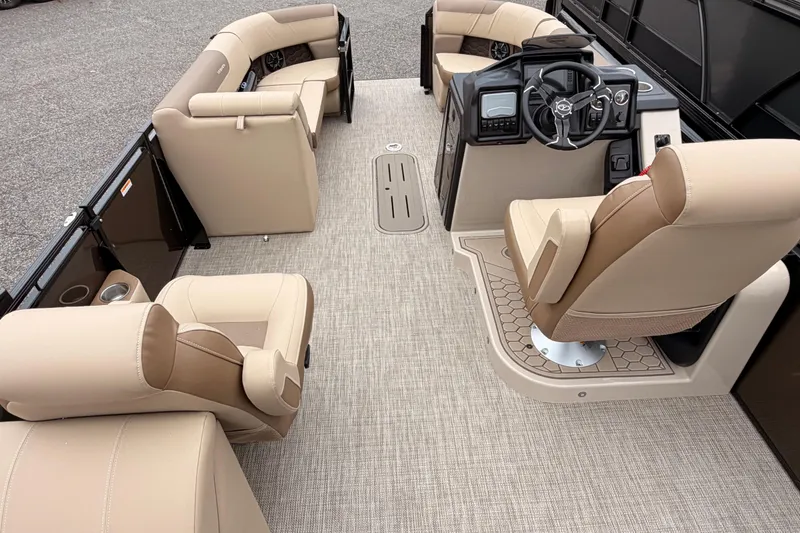 Slide: The Image of 2026 Veranda VR 235 L pontoon boat interior with beige seating and modern dashboard. - 15