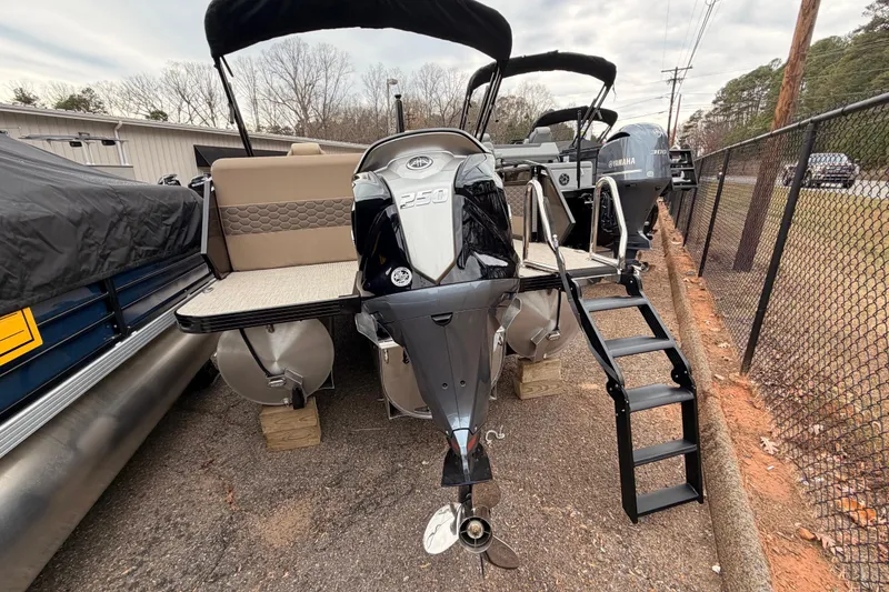 Slide: The Image of 2026 Veranda VR 235 L pontoon boat with Yamaha 250 engine, docked with ladder. - 18