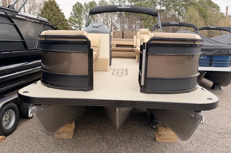 Slide: The Image of 2026 Veranda VR 235 L pontoon boat with beige seating and black accents. - 2