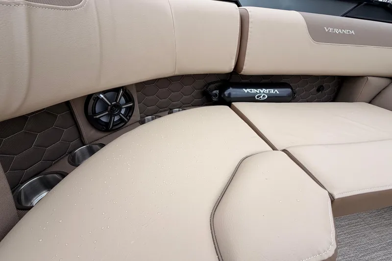 Slide: The Image of Luxurious interior of 2026 Veranda VR 235 L boat with beige seating and cup holders. - 7