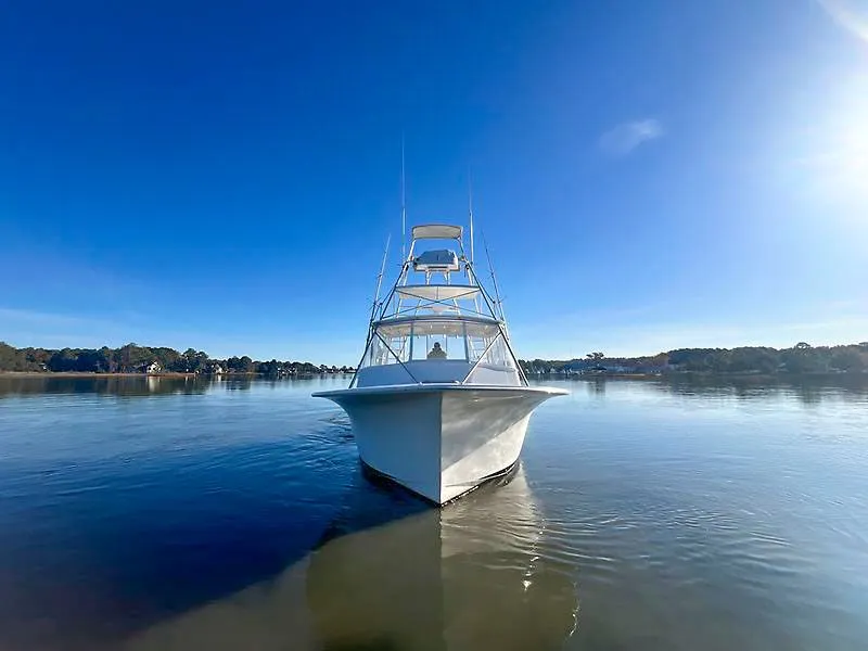 Slide: The Image of Jersey Cape 36 Express 1998 on calm water under clear sky. - 1