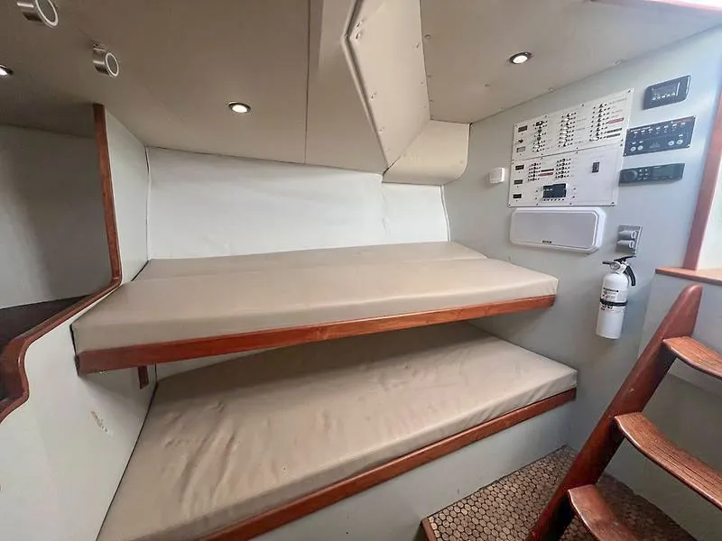Slide: The Image of Interior of 1998 Jersey Cape 36 Express with bunk beds. - 11
