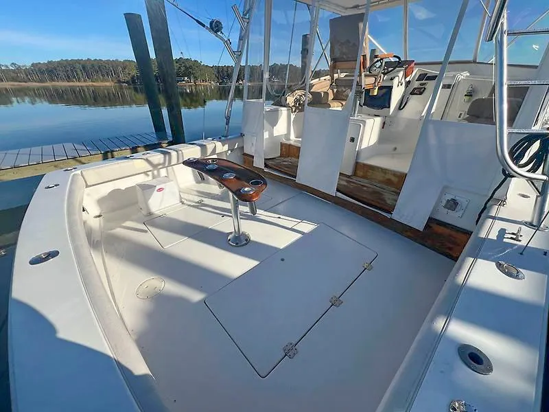 Slide: The Image of Jersey Cape 36 Express 1998 boat at serene lake. - 17