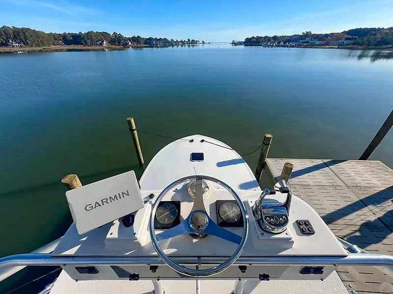 Slide: The Image of Jersey Cape 36 Express 1998 helm with Garmin on calm waters. - 18