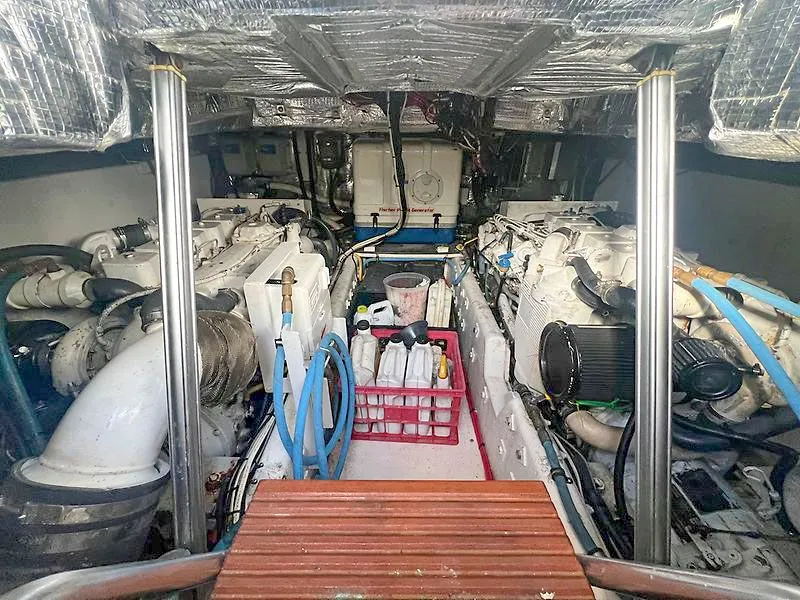 Slide: The Image of Engine room of a 1998 Jersey Cape 36 Express boat. - 19