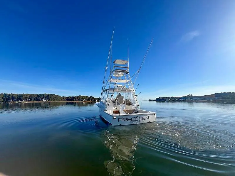 Slide: The Image of Jersey Cape 36 Express 1998 on calm water under clear sky. - 2