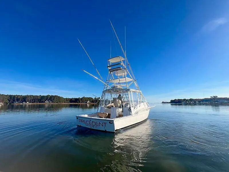 Slide: The Image of 1998 Jersey Cape 36 Express boat on calm water. - 3