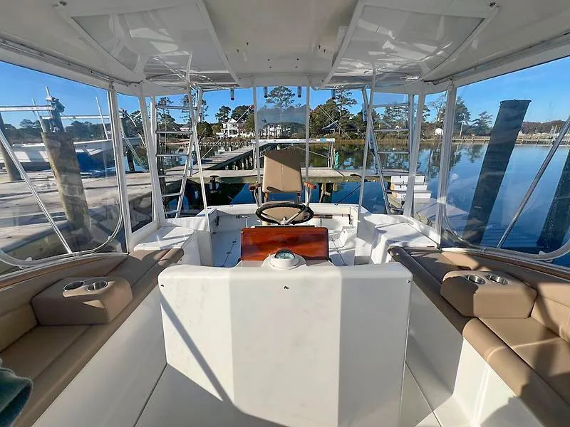 Slide: The Image of Interior view of a 1998 Jersey Cape 36 Express boat at dock. - 6