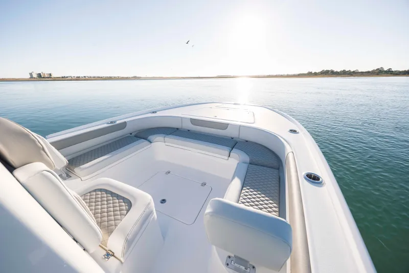 Slide: The Image of Luxurious Caymas 26 HB boat on calm waters, year 2026. - 12