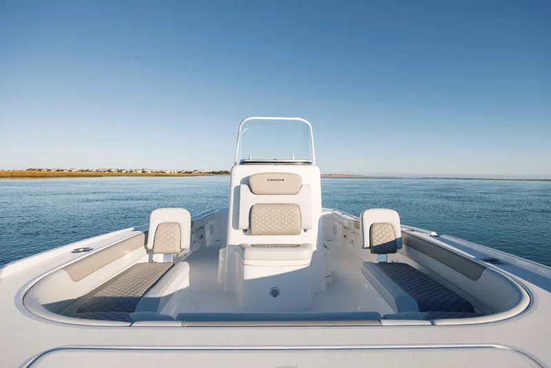 Slide: The Image of Caymas 26 HB 2026 boat on calm water. - 15