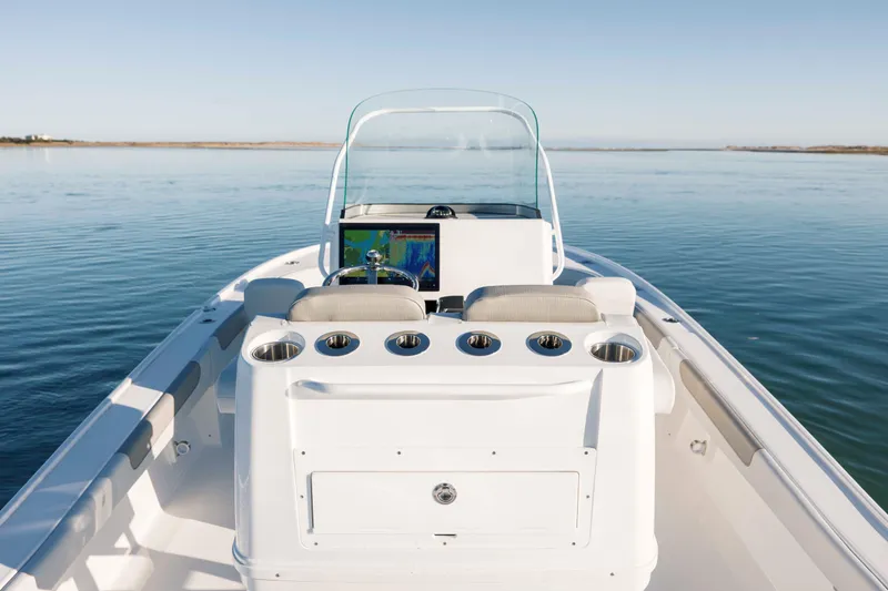 Slide: The Image of Caymas 26 HB 2026 boat on calm water. - 25