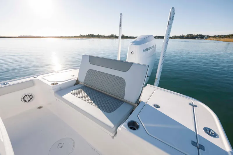 Slide: The Image of Caymas 26 HB 2026 boat with Mercury engine on calm water. - 28