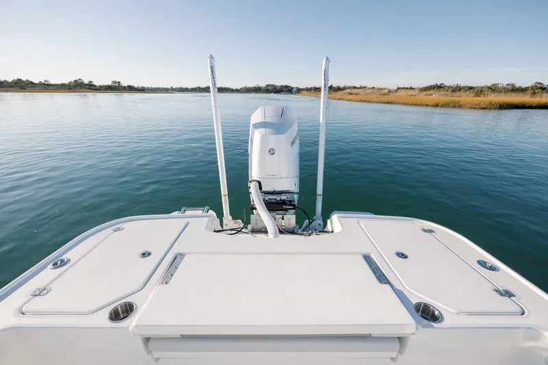 Slide: The Image of Rear view of Caymas 26 HB boat on calm water. - 29