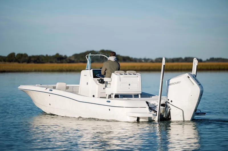 Slide: The Image of 2026 Caymas 26 HB boat on calm water. - 4