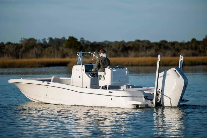 Slide: The Image of Caymas 26 HB 2026 boat on calm water. - 5