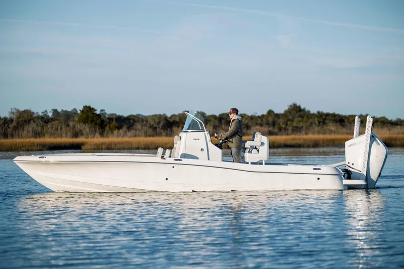 Slide: The Image of 2026 Caymas 26 HB boat on calm water. - 6