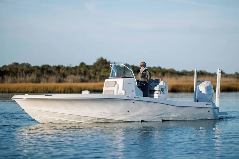 Slide: The Image of 2026 Caymas 26 HB boat on calm water. - 8