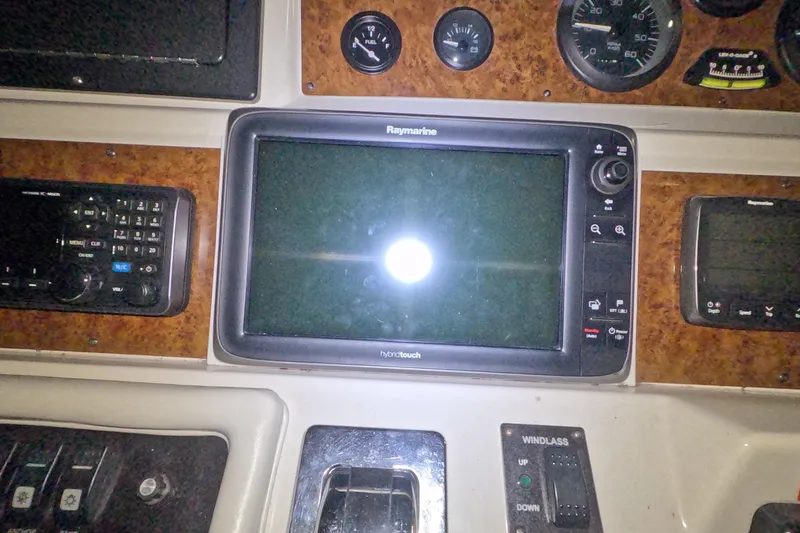 Slide: The Image of Control panel of a 1995 Sea Ray 400 Express Cruiser with Raymarine display. - 14