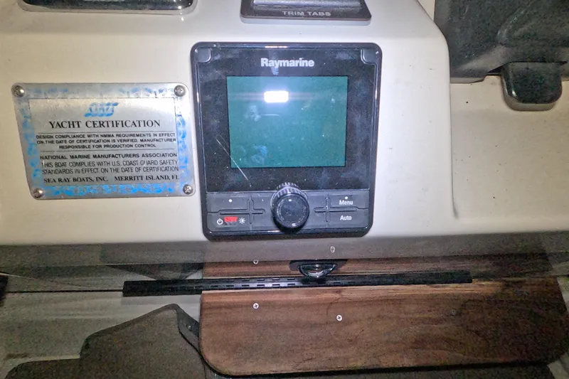 Slide: The Image of Control panel of a 1995 Sea Ray 400 Express Cruiser with yacht certification plaque. - 15