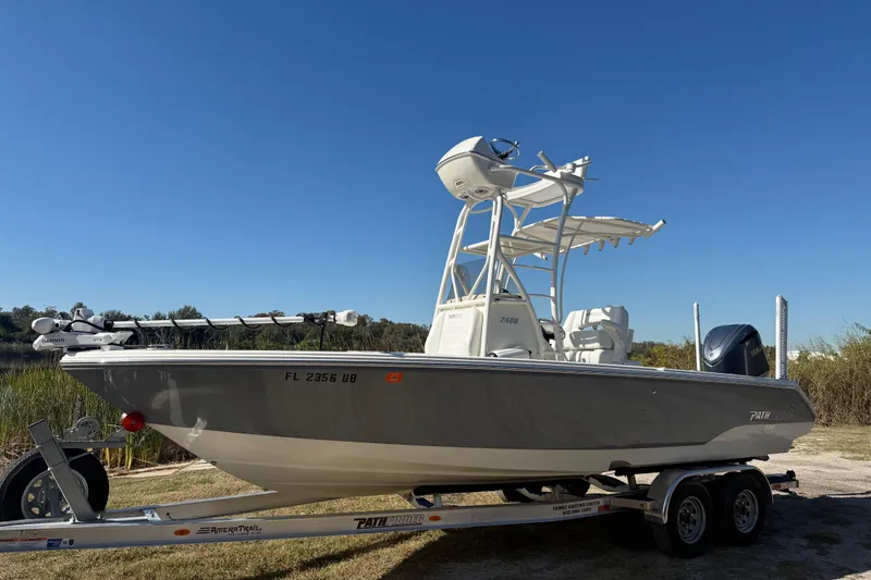 The Image of 2025 Pathfinder 2400 Open boat on trailer under clear blue sky. - 0