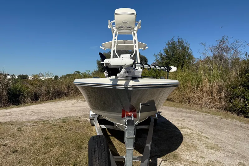 Slide: The Image of 2025 Pathfinder 2400 Open boat on trailer, parked outdoors on a sunny day. - 10