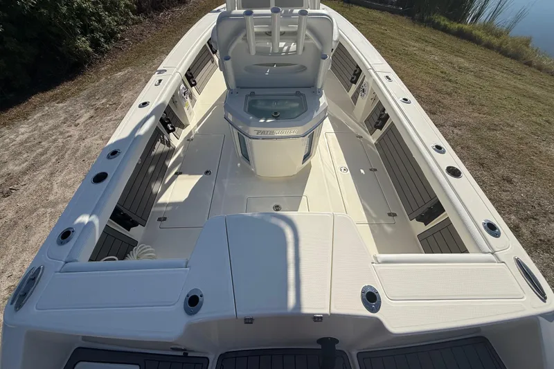 Slide: The Image of 2025 Pathfinder 2400 Open boat interior with seating and storage compartments. - 12