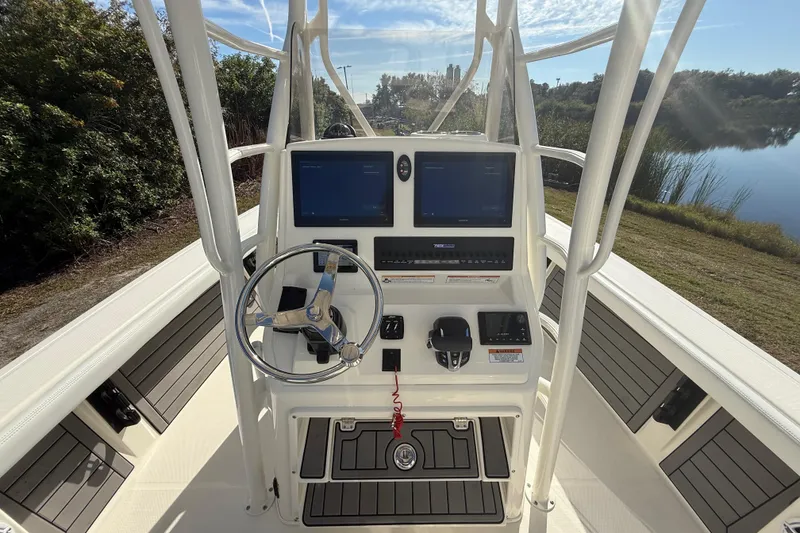 Slide: The Image of 2025 Pathfinder 2400 Open boat console with dual screens and steering wheel. - 15