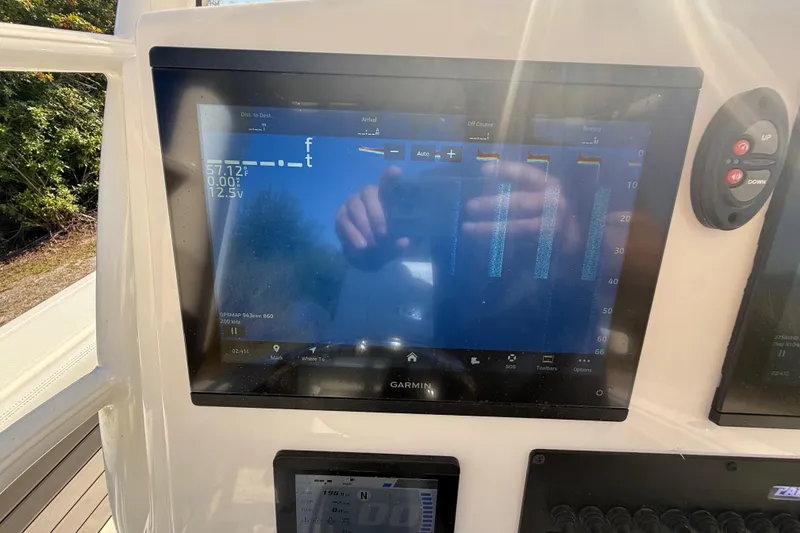 Slide: The Image of Garmin display on 2025 Pathfinder 2400 Open boat showing navigation data. - 16