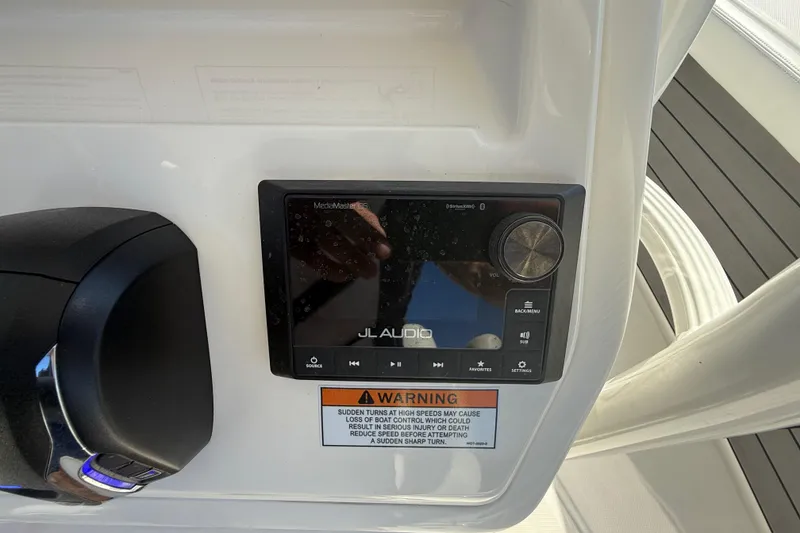 Slide: The Image of Control panel of a 2025 Pathfinder 2400 Open boat with JL Audio system. - 18