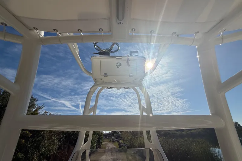 Slide: The Image of 2025 Pathfinder 2400 Open boat with clear sky and sunlit view. - 20