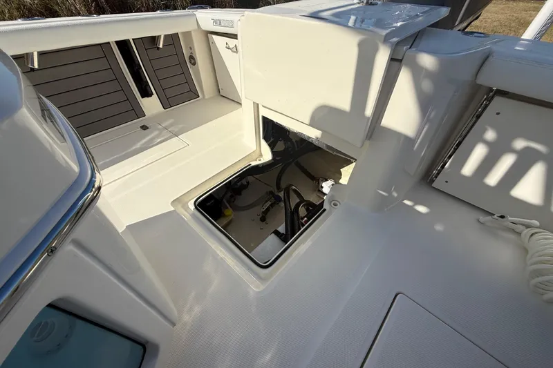Slide: The Image of 2025 Pathfinder 2400 Open boat interior with open hatch and storage area. - 32