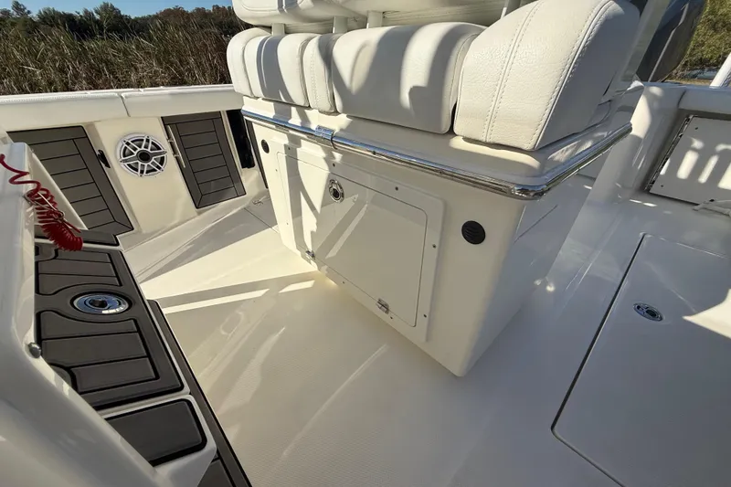 Slide: The Image of 2025 Pathfinder 2400 Open boat interior with cushioned seating and storage compartments. - 39