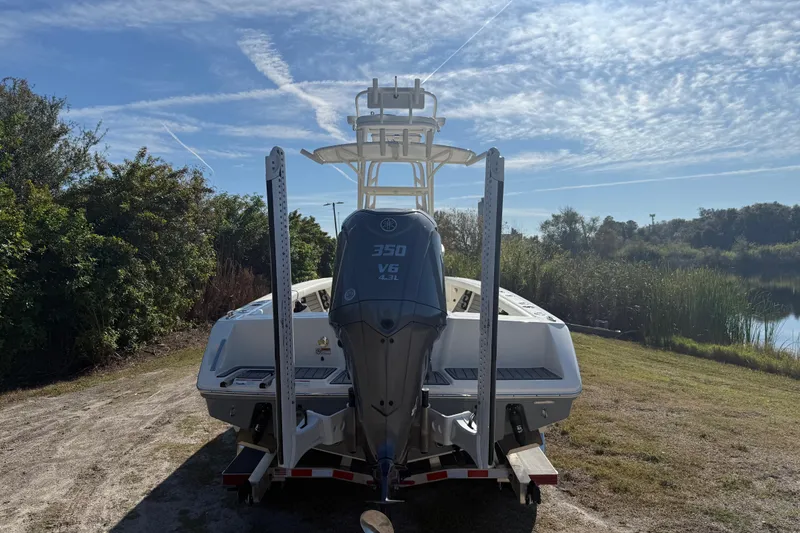 Slide: The Image of 2025 Pathfinder 2400 Open boat with Yamaha 350 V6 engine, parked near a lake. - 4