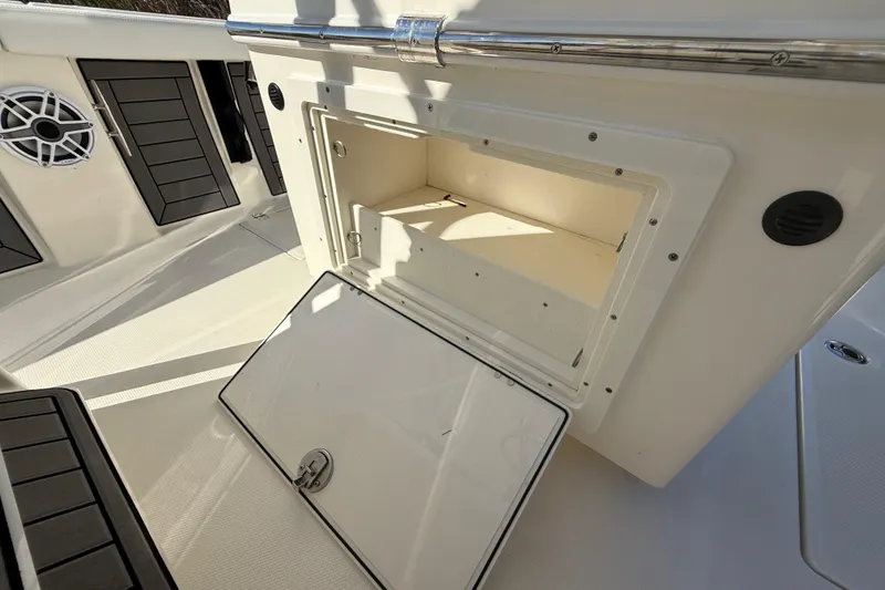 Slide: The Image of 2025 Pathfinder 2400 Open boat storage compartment with open hatch, showcasing interior space. - 40