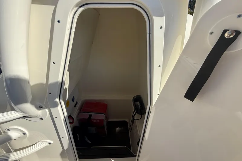 Slide: The Image of Interior cabin of 2025 Pathfinder 2400 Open boat, featuring storage and equipment. - 46