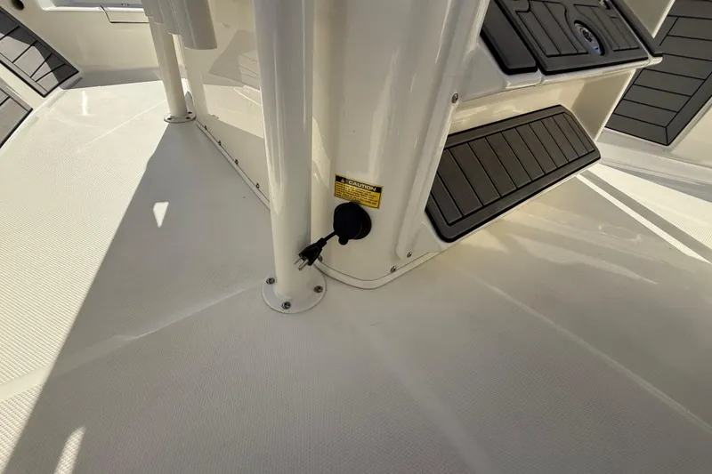 Slide: The Image of 2025 Pathfinder 2400 Open boat interior with non-slip flooring and storage compartments. - 47