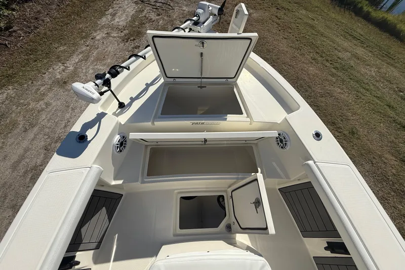 Slide: The Image of 2025 Pathfinder 2400 Open boat deck with open storage compartments and trolling motor. - 48